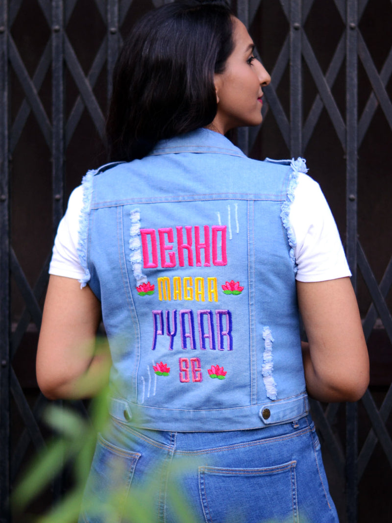 Dekho Magar Pyaar Se Sasswati Denim Jacket, a hand embroidered blue denim jacket from our latest designer collection of boho denim jackets for women online.